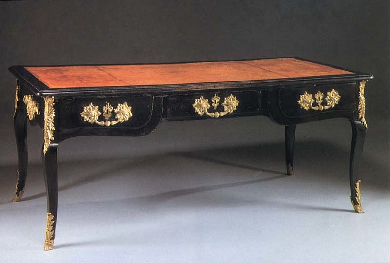 18th Century FRENCH, Régence Black Lacquer Bureau Plat, 1700-1725
Black lacquered wood, 28 3/4 x 70 7/8 x 34 1/2 in. (73 x 180 x 87.6 cm)
Rectangular top with a leather-lined writing surface above three short drawers and fitted with faux drawers on the reverse, raised on cabriole legs, the whole fitted with later ormulu mounts.
FRE-001-FU